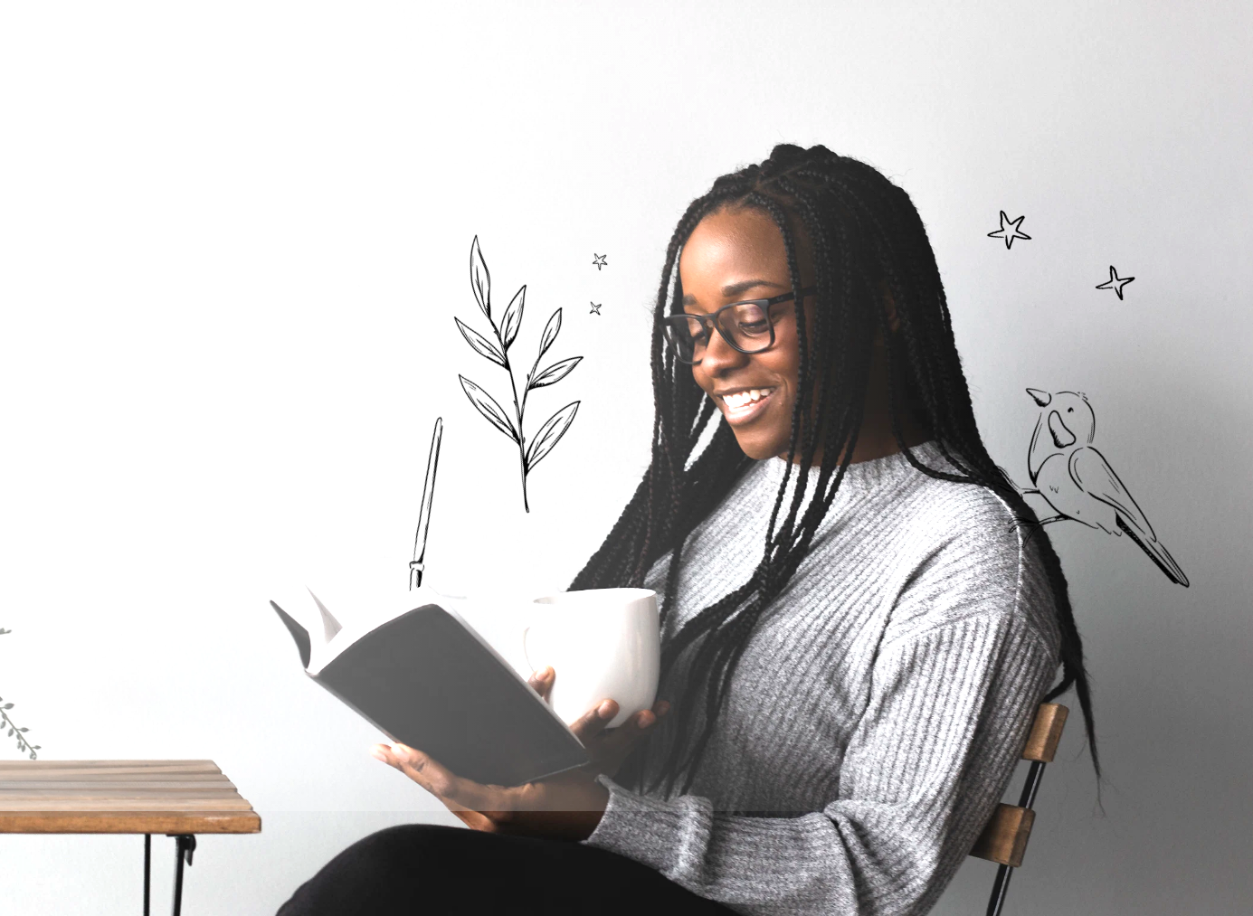 A woman reading a book with birds and flowers illustrated around her